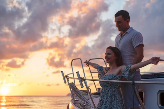 Loving couple spending time on a yacht at the open sea