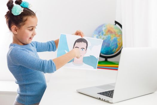 little girl studying biology online. All the research is online. distance learning