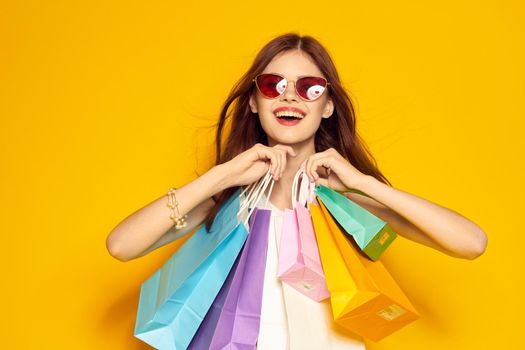 glamorous woman with packages in hands Shopaholic isolated background. High quality photo