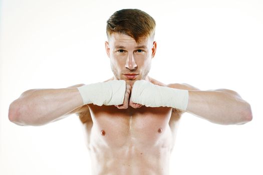 muscular man with bandaged arms gym boxer. High quality photo