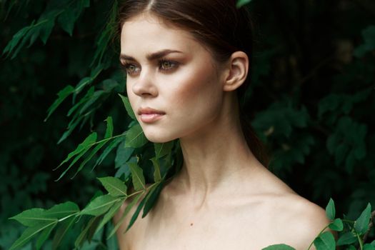 beautiful woman green leaves clean skin nature summer model. High quality photo