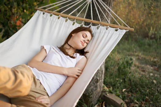 woman sleeping in hammock outdoors leisure lifestyle. High quality photo