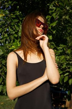 pretty woman wearing sunglasses summer nature posing. High quality photo