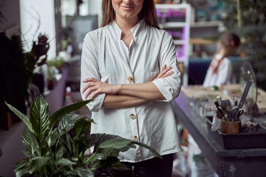 Portrait of caucasian female florist in its own florist shop