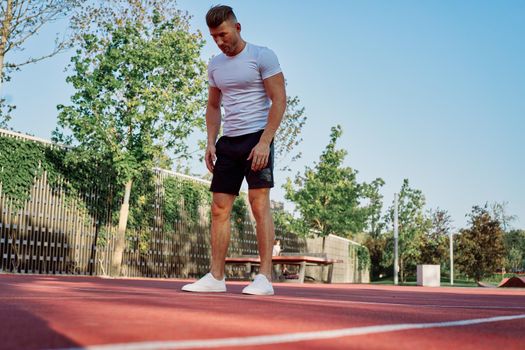 man doing exercises outdoors on the playground. High quality photo