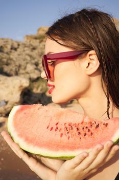 woman eating watermelon outdoors Sun summer close-up. High quality photo