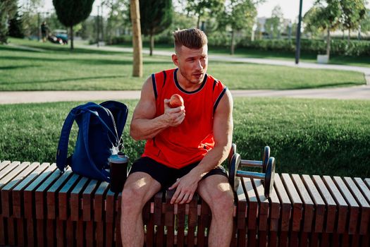 sporty man in the park workout exercise fitness motivation. High quality photo