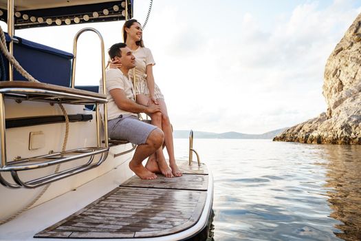 Loving couple spending time on a yacht at the open sea