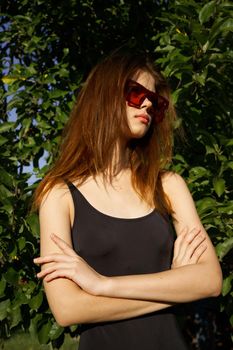 pretty woman wearing sunglasses summer nature posing. High quality photo