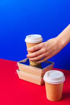 Delivery man hands giving food containers and packages. Delivery concept