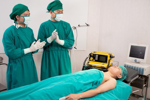 Doctor and surgeon preparation with rescue and  save patient in the operation room at hospital, surgery and emergency, medical and technology, surgical and health, specialist and assistant.