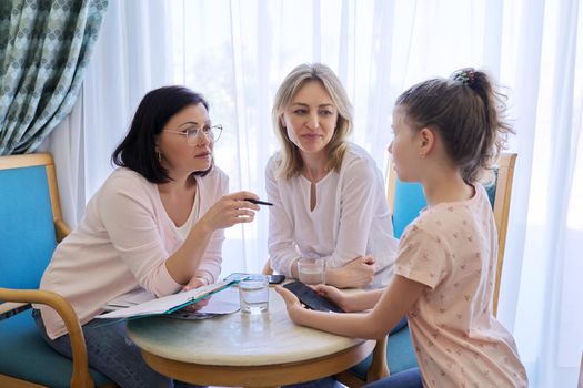Mom and daughter preteen child at meeting with psychologist, therapist. Family problems, child psychology, children's mental health. Professional help and support