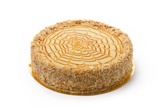 One caramel cake isolated on white background close up