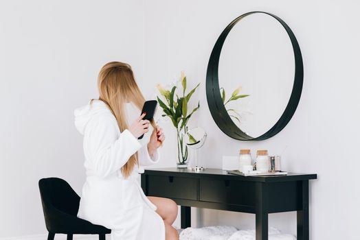 blonde girl looking her reflection