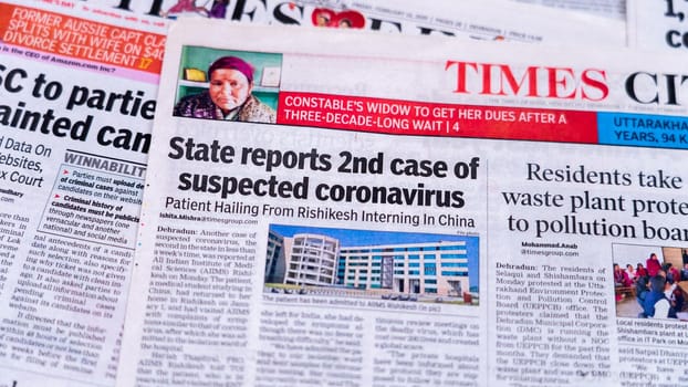 Dehradun, Uttarakhand India June 28, 2021. Coronavirus COVID-19 News Headline in Newspaper of India. Headlines of the month March, April 2020. High-quality apple prores 422 4k footage 60p.