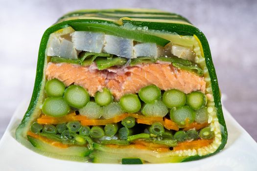 Recipe of marbled vegetables, salmon and langoustines, terrine salmon vegetables and langoustines. High quality photo