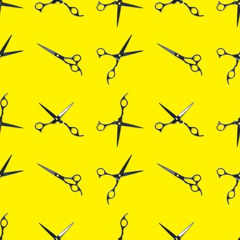 Seamless pattern of black scissors. professional hairdresser black scissors isolated on yellow. Black barber scissors, close up. pop art background, for prints or posters