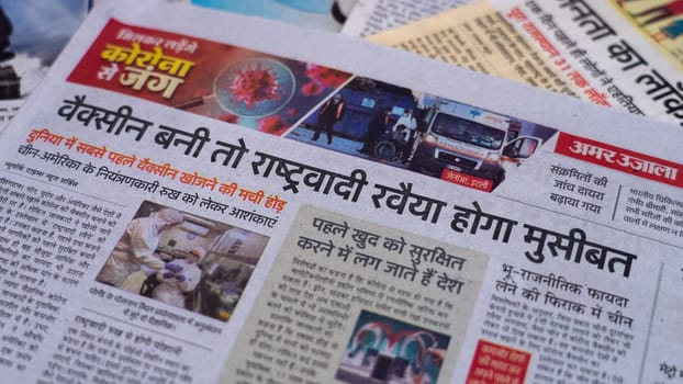 Dehradun, Uttarakhand India June 28, 2021. Hindi, Coronavirus COVID-19 News Headline in Newspaper of India. Headlines of the month March, April 2020.