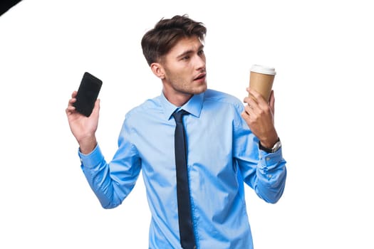 man in shirt with tie communication on the phone a cup of coffee official. High quality photo