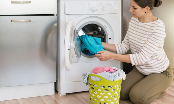 casual woman doing laundry