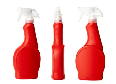 Orange plastic bottle of liquid detergent isolated on white background