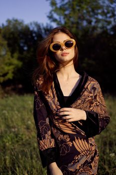 fashionable woman in sunglasses outdoors summer glamor. High quality photo