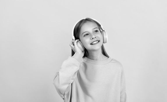 music lover. listen to music. wireless headset device accessory. new technology. childhood development. child in modern earphones. online education. back to school. happy teen girl in headphones.