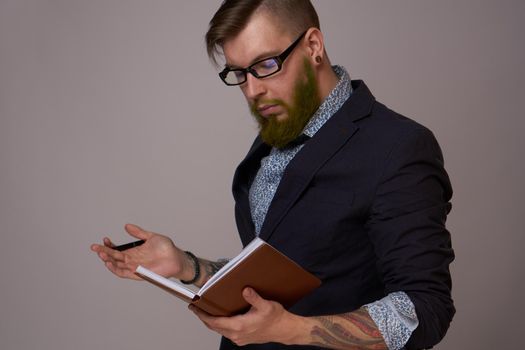 manager in a jacket with a notebook in his hands work office. High quality photo