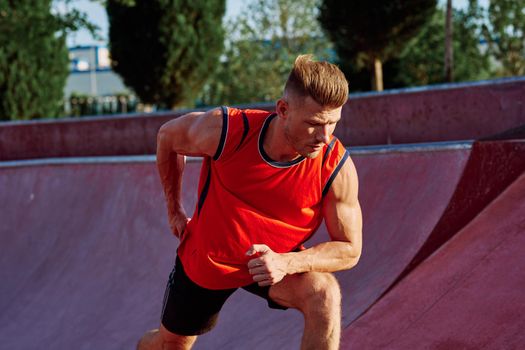 man doing exercises outdoors in the park. High quality photo