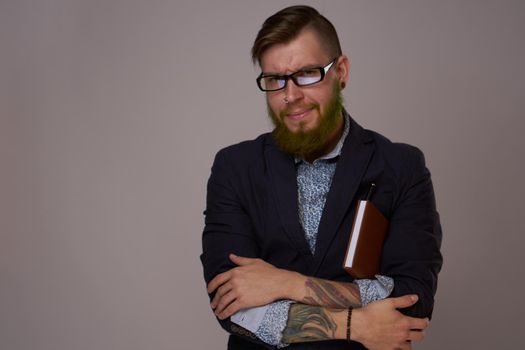 business man with glasses with tattoos on his arms office professionals. High quality photo