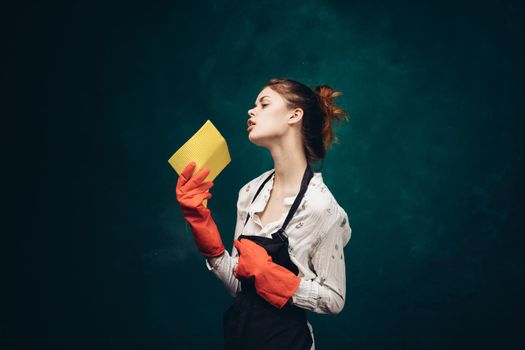 cleaning lady in red rubber gloves with a rag in her hands housekeeping. High quality photo