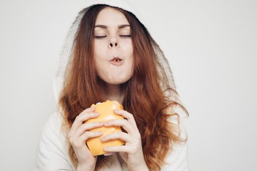 red-haired woman eating a sandwich snack lunch. High quality photo