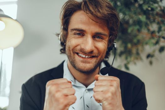 Bearded man businessman with headset having online business conversation close up