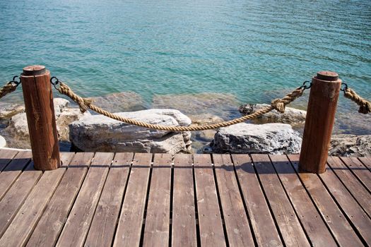 Empty wooden jetty on the lake shore