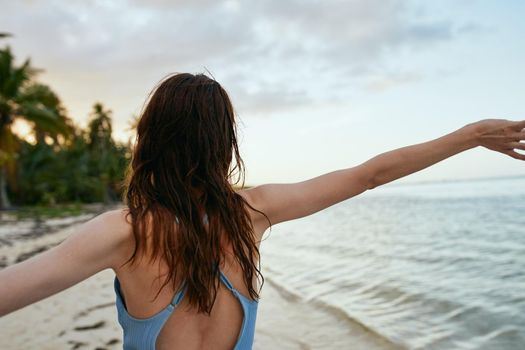 woman in blue swimsuit on the beach island lifestyle. High quality photo