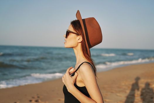 pretty woman on the beach summer vacation lifestyle sun. High quality photo