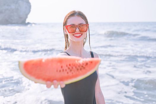 cheerful pretty woman in black swimsuit watermelon fashion travel. High quality photo