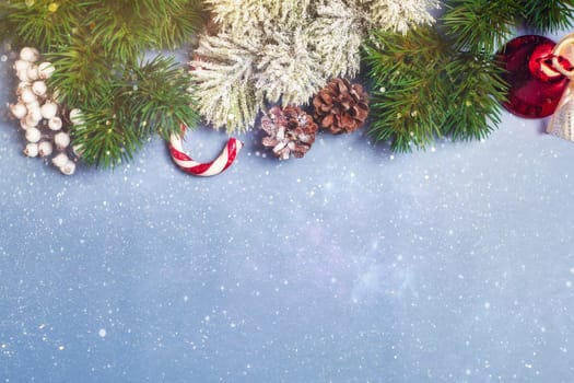 Christmas background with fir tree and decor. Top view with copy space