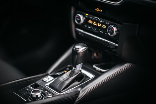 The gear shift lever in the modern car, close up shot of gearshift