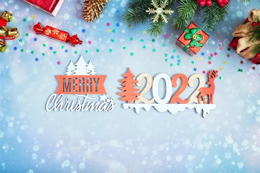 Festive Christmas greeting card with decorated fir tree and copy space for your xmas greetings. Top view flat lay