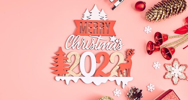 Christmas wooden background with snow fir tree. View with copy space . Copy space framed by Christmas tree branches, decorations, sweets.