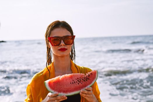 woman in swimsuit with watermelon outdoors sun fresh air. High quality photo