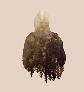 Double exposure image of male backpacker and pine tree forest.