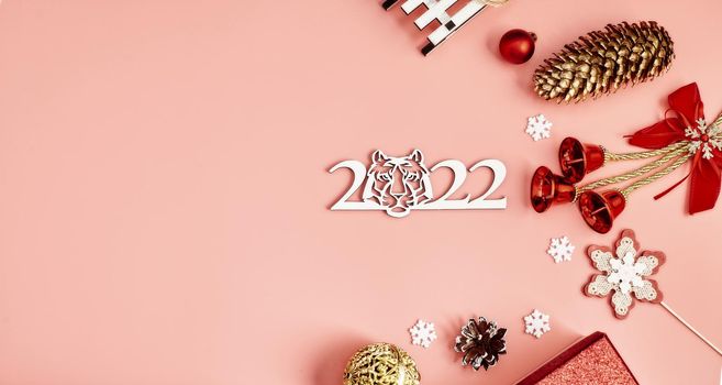 Happy New Year holiday concept. New Year decorations,  tree, snowflake, pine cone, gifts on  background. Holiday party greeting card mockup with copy space. Flat lay, top view, overhead.