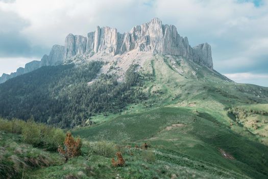 Summer landscape. Mountain with rocky peak Big Thach in summer season, Adygea, Russia.