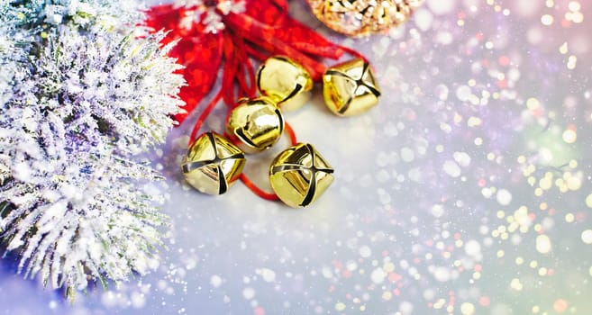 Christmas composition of spruce branches, gift, cinnamon, anise and confetti stars on rustic wooden background. Flat plan, top view