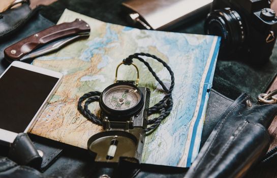 Equipment for tourism and travel. Map and compass.