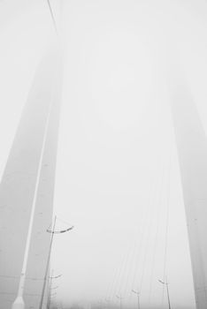 Modern bridge in the fog.
