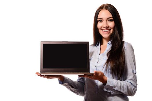 Cute charming woman showing laptop computer screen isolated on a white background