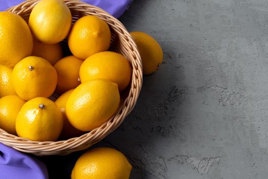 Lemons on concrete background, view from above. High quality photo